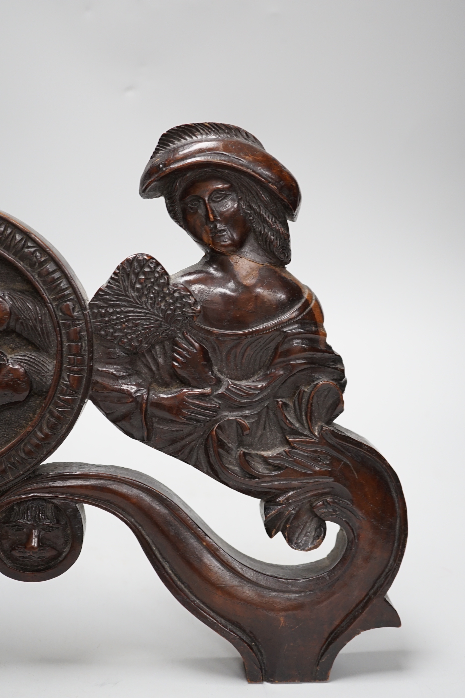 A 19th century carved figural door pediment, 46cm wide
